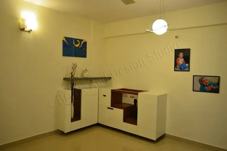 Compact modular kitchen with pale cabinetry.