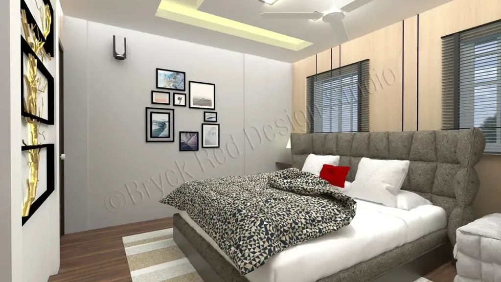 Bedroom with an upholstered headboard wall and bedside lighting.