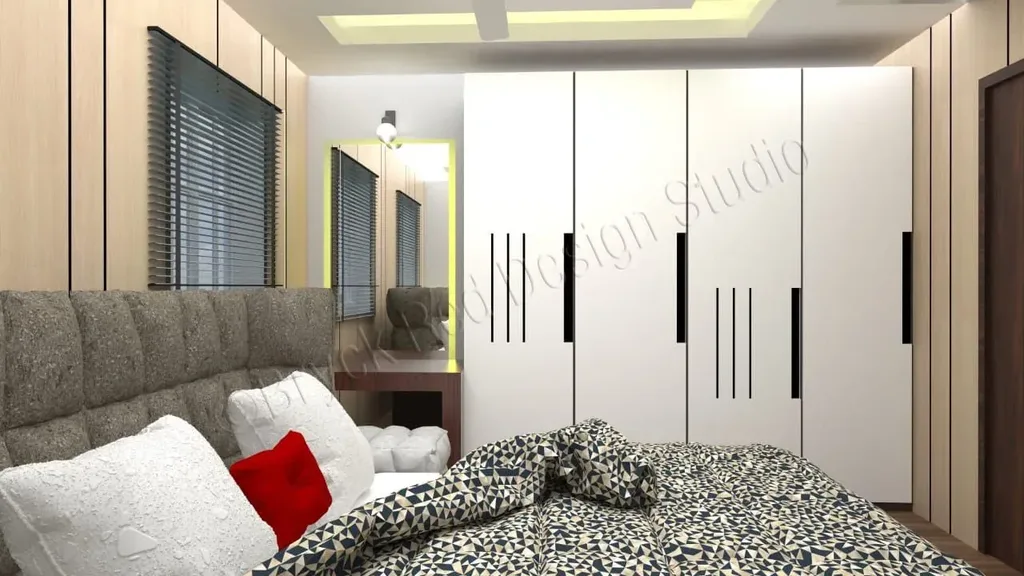 Bedroom with a full-height white wardrobe run and a dressing mirror.